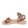 Girl's thong sandals in fuchsia calfskin with buckle closure